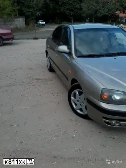 Фото автомобиля HYUNDAI ELANTRA, 2004 — госномер Е100КМ790. Цвет: БЕЖЕВЫЙ