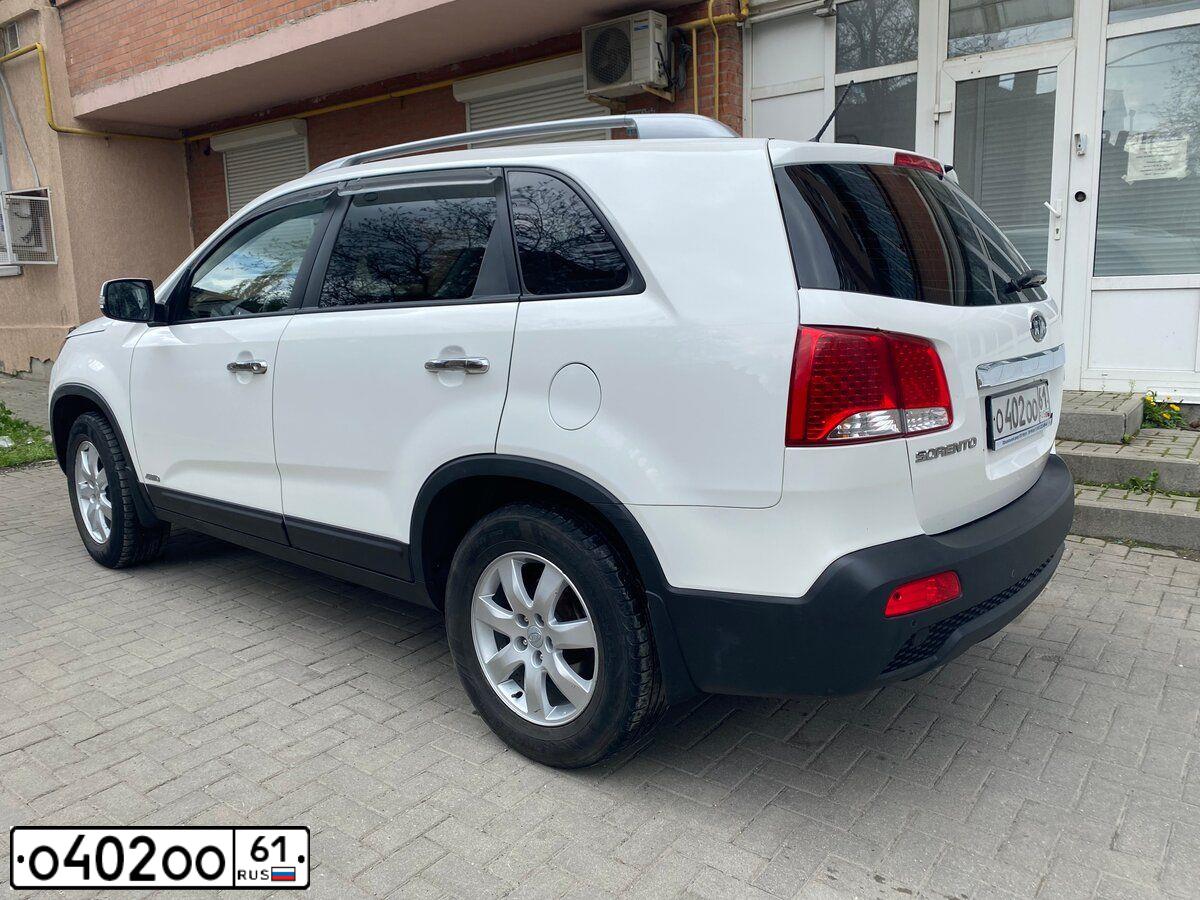 Фото автомобиля KIA SORENTO, 2009 — госномер М597ЕТ761. Цвет: Белый