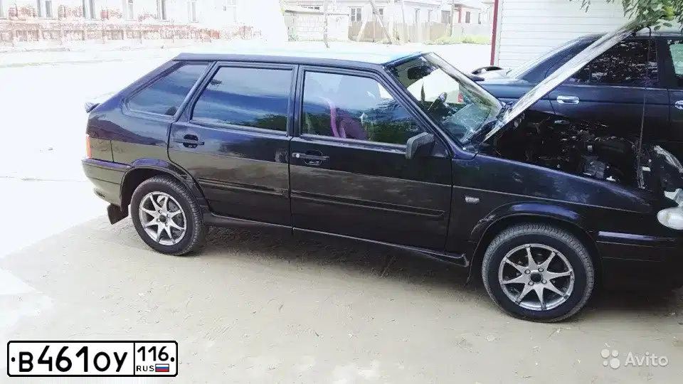 Фото автомобиля LADA 2114 SAMARA, 2010 — госномер Е976МС30. Цвет: СИНЕ-ЧЕРНЫЙ