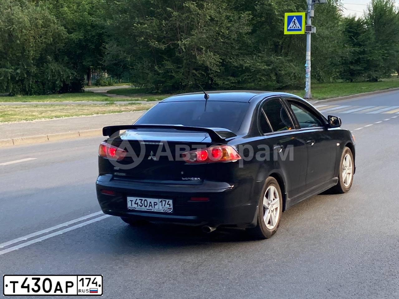 Фото автомобиля MITSUBISHI LANCER, 2007 — госномер Т430АР174. Цвет: ЧЕРНЫЙ