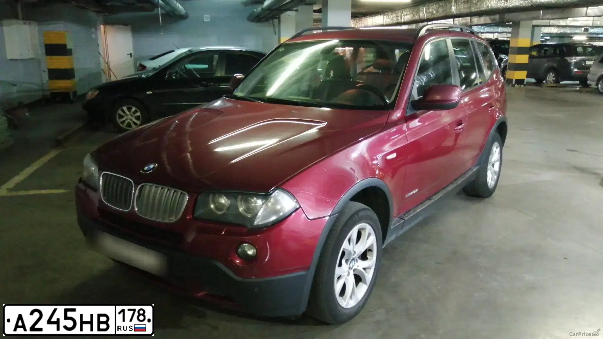 Фото автомобиля BMW X3, 2010 — госномер А245НВ178. Цвет: КРАСНЫЙ МЕТАЛЛИК