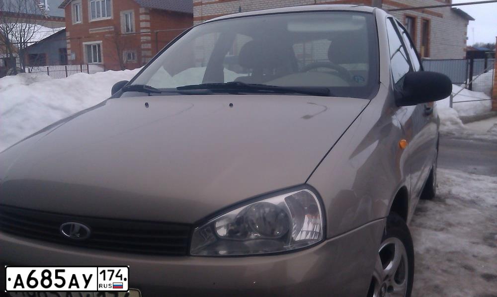 Фото автомобиля LADA 1119 KALINA, 2007 — госномер Н710ОВ174. Цвет: БЕЖЕВО-СЕРЫЙ
