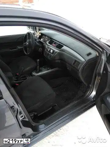 Фото автомобиля MITSUBISHI LANCER, 2006 — госномер Н219ХР48. Цвет: СЕРЫЙ