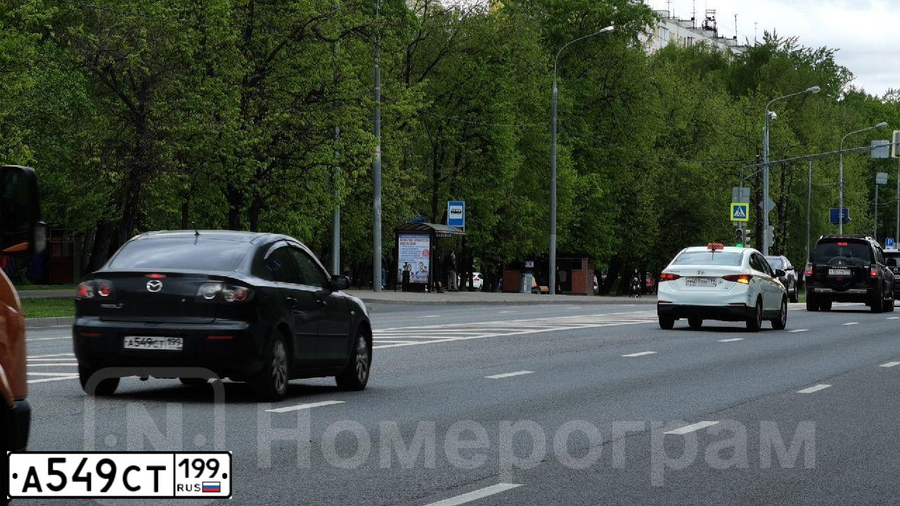 Фото автомобиля MAZDA 3, 2006 — госномер А549СТ199. Цвет: ЧЕРНЫЙ