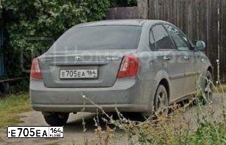 Фото автомобиля DAEWOO GENTRA, 2015 — госномер Е705ЕА164. Цвет: ТЕМНО-СЕРЫЙ