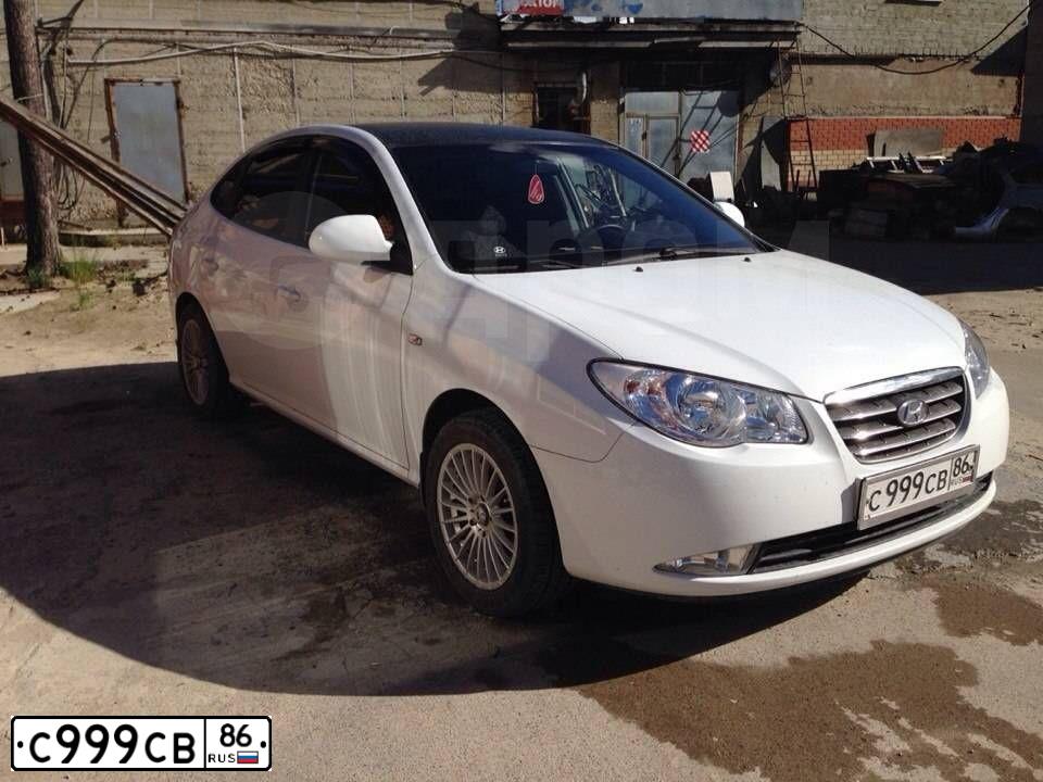 Фото автомобиля KIA SPECTRA, 2006 — госномер Е186СА186. Цвет: алмазное серебро (белый)