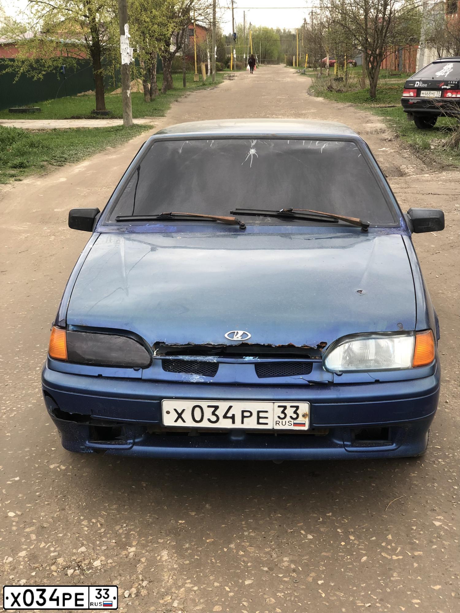 Фото автомобиля LADA 2114 SAMARA, 2004 — госномер Х034РЕ33. Цвет: СЕРЕБРИСТО-СИНИЙ
