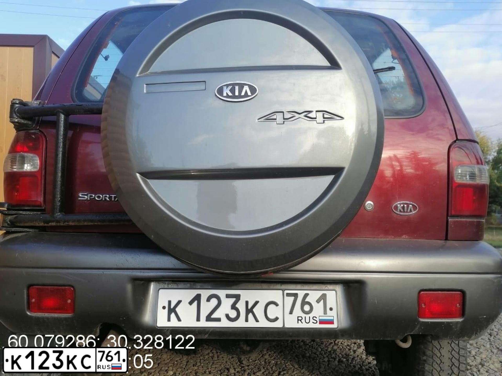 Фото автомобиля KIA SPORTAGE, 2004 — госномер К123КС761. Цвет: БОРДОВЫЙ