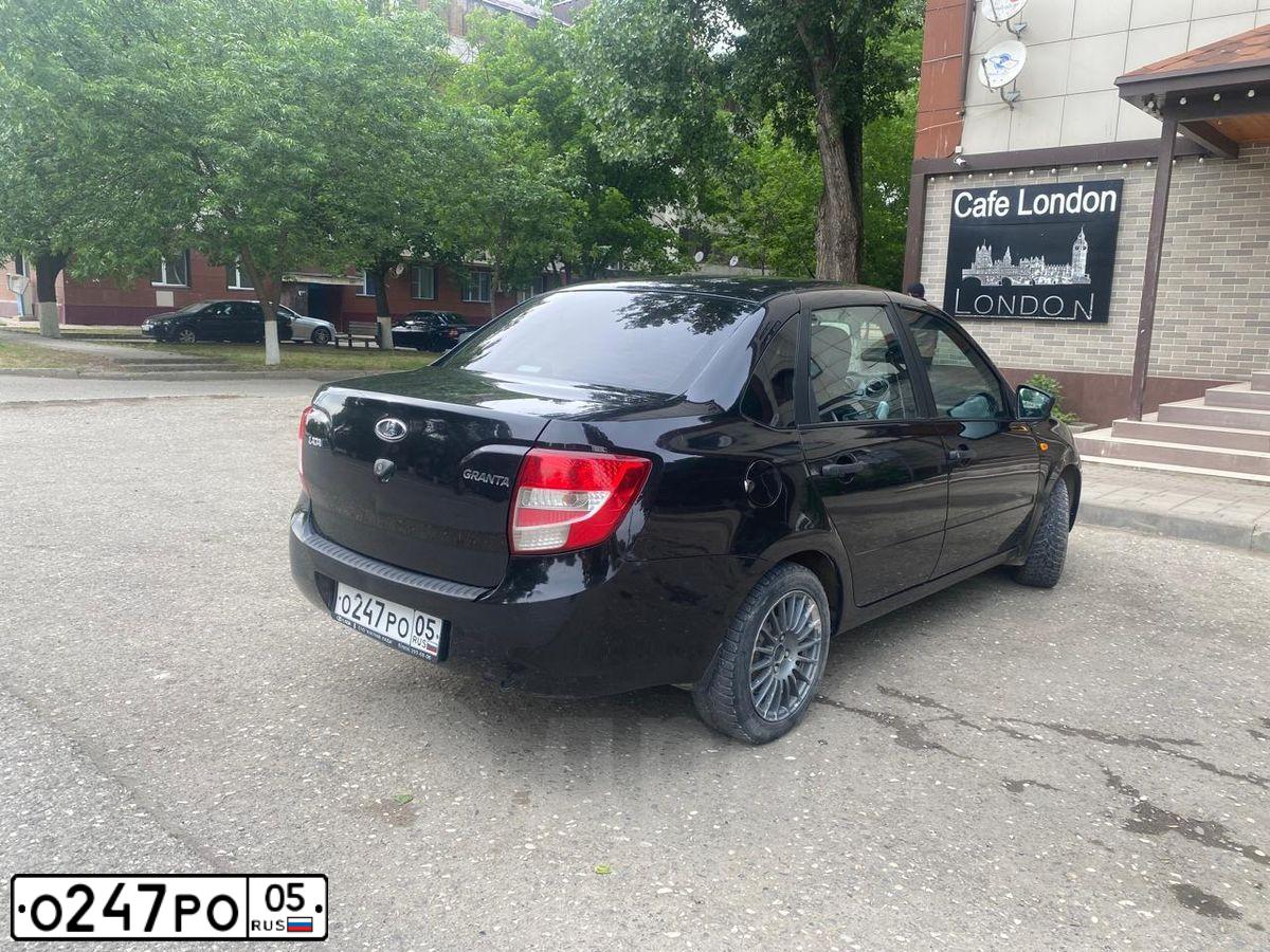 Фото автомобиля LADA 2190 GRANTA, 2018 — госномер О247РО05. Цвет: ЧЕРНЫЙ