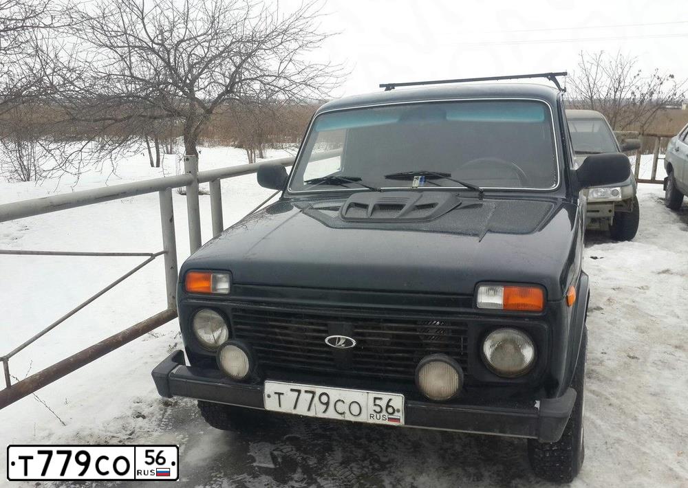 Фото автомобиля LADA 2121 NIVA, 2012 — госномер Т779СО56. Цвет: ТЕМНО-ЗЕЛЕНЫЙ