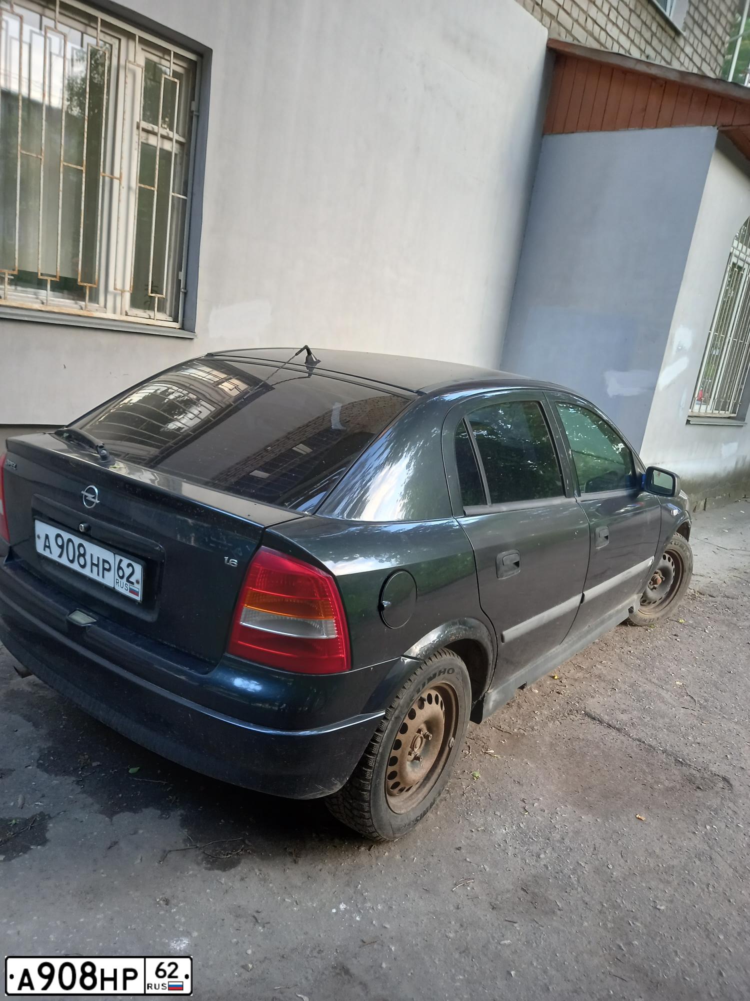Фото автомобиля OPEL ASTRA, 1998 — госномер Т539НА62. Цвет: ЧЕРНЫЙ
