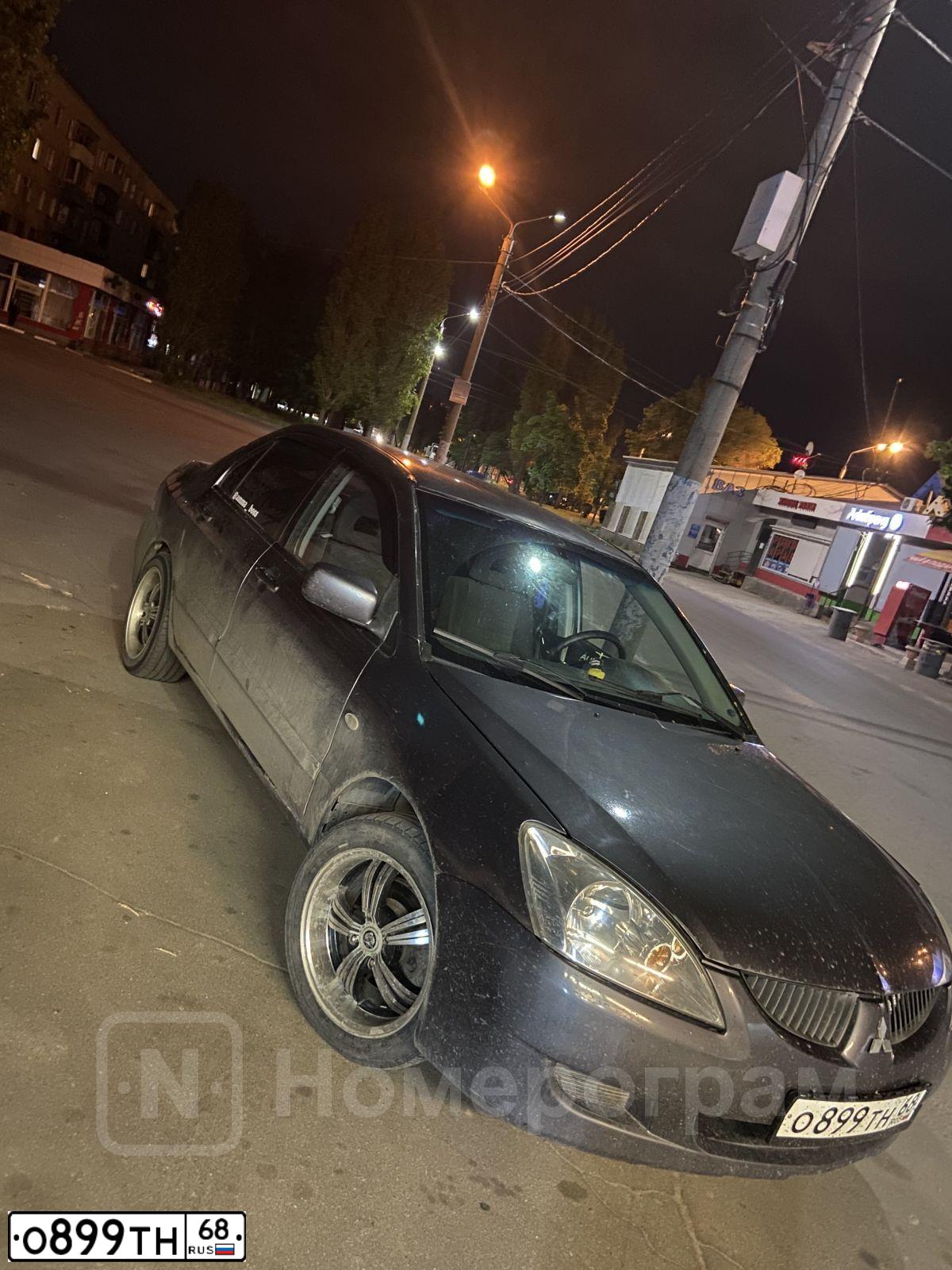 Фото автомобиля MITSUBISHI LANCER, 2005 — госномер О899ТН68. Цвет: СЕРЫЙ