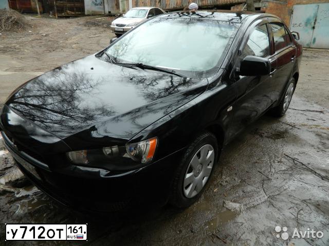 Фото автомобиля MITSUBISHI LANCER, 2010 — госномер Н669УУ161. Цвет: ЧЕРНЫЙ