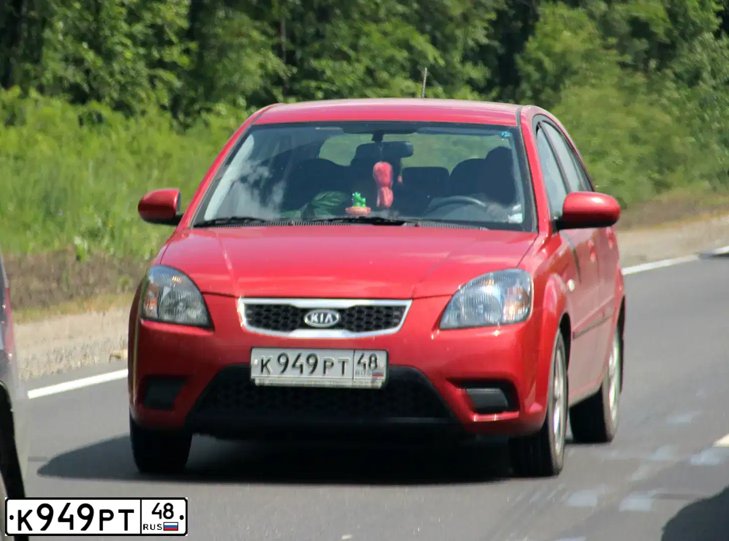 Фото автомобиля KIA RIO, 2010 — госномер К949РТ48. Цвет: Красный