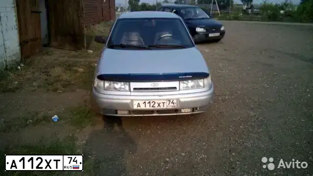 Фото автомобиля LADA 2112, 2004 — госномер А112ХТ74. Цвет: СВЕТЛО-СЕРЕБРИСТЫЙ МЕТАЛЛ