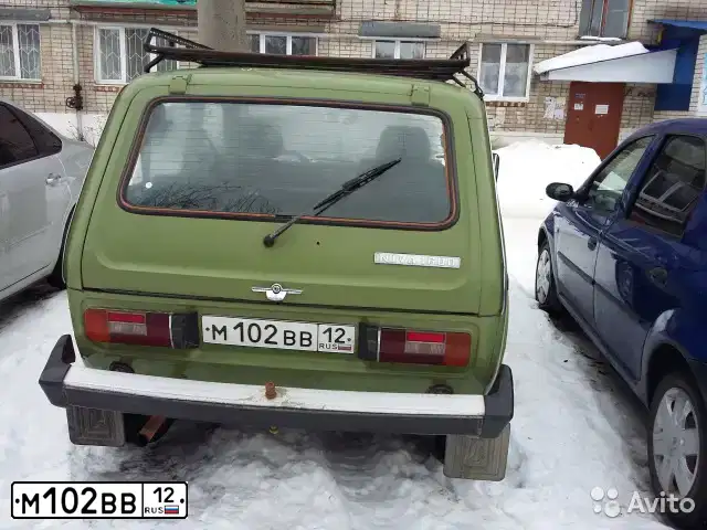 Фото автомобиля LADA 2121 NIVA, 1992 — госномер М102ВВ12. Цвет: ОЛИВКОВЫЙ