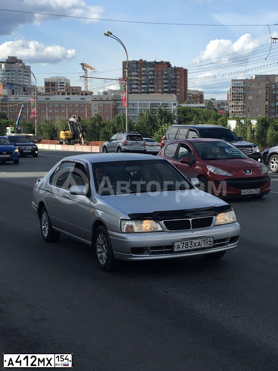 Фото автомобиля PEUGEOT 207, 2008 — госномер О731НТ154. Цвет: Красный