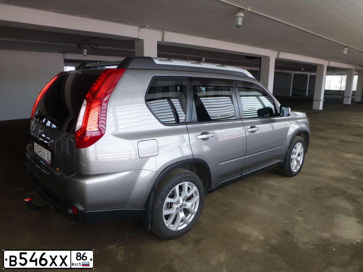 Фото автомобиля NISSAN X-TRAIL, 2011 — госномер Е360СТ186. Цвет: СЕРЫЙ