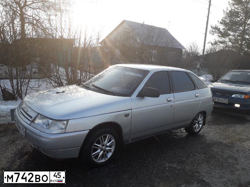Фото автомобиля LADA 2112, 2003 — госномер Х458ОХ72. Цвет: Светло-Серебристый металлик