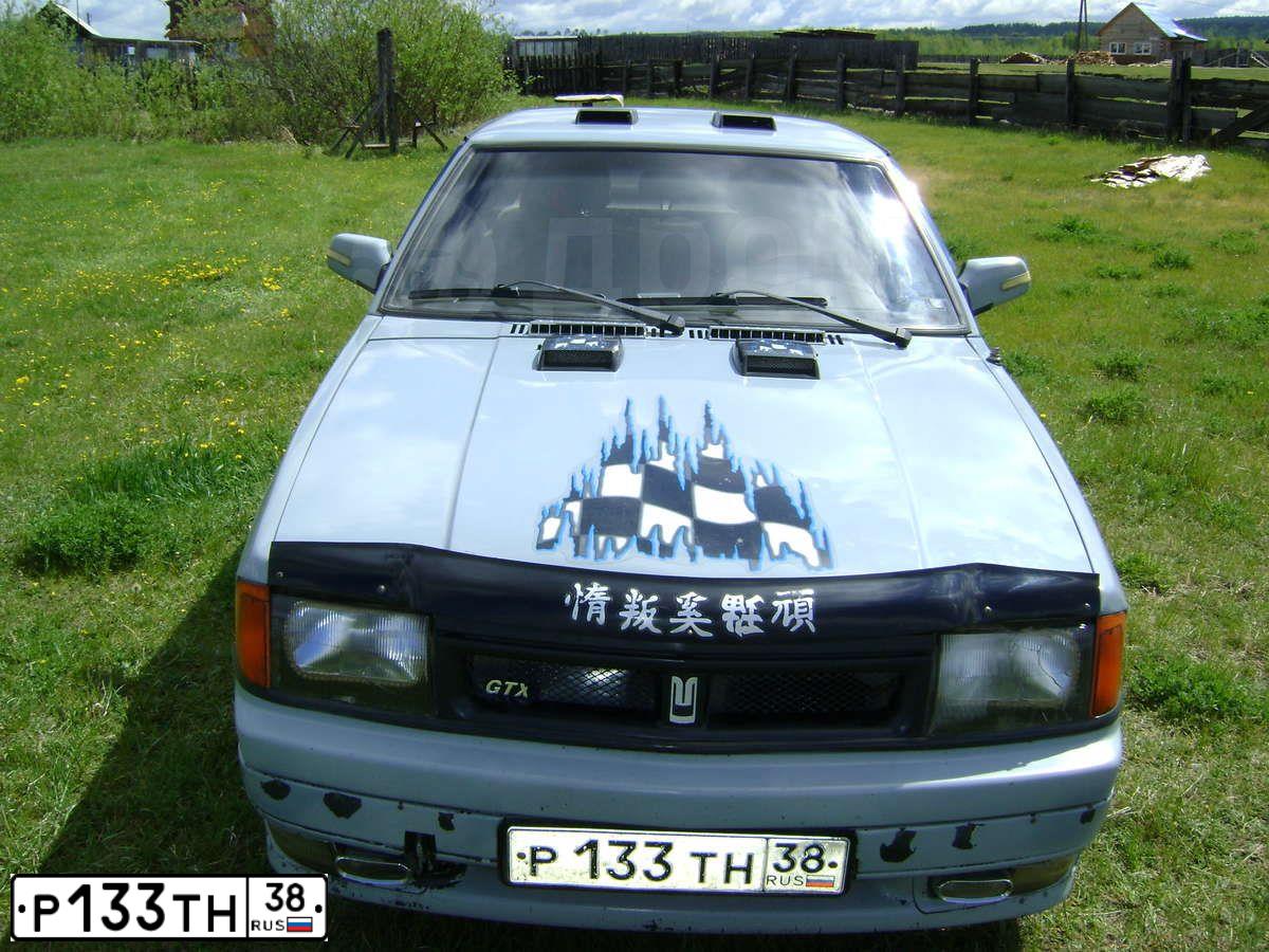 Фото автомобиля AZLK MOSKWITSCH 2141, 1997 — госномер Р133ТН38. Цвет: СЕРЫЙ