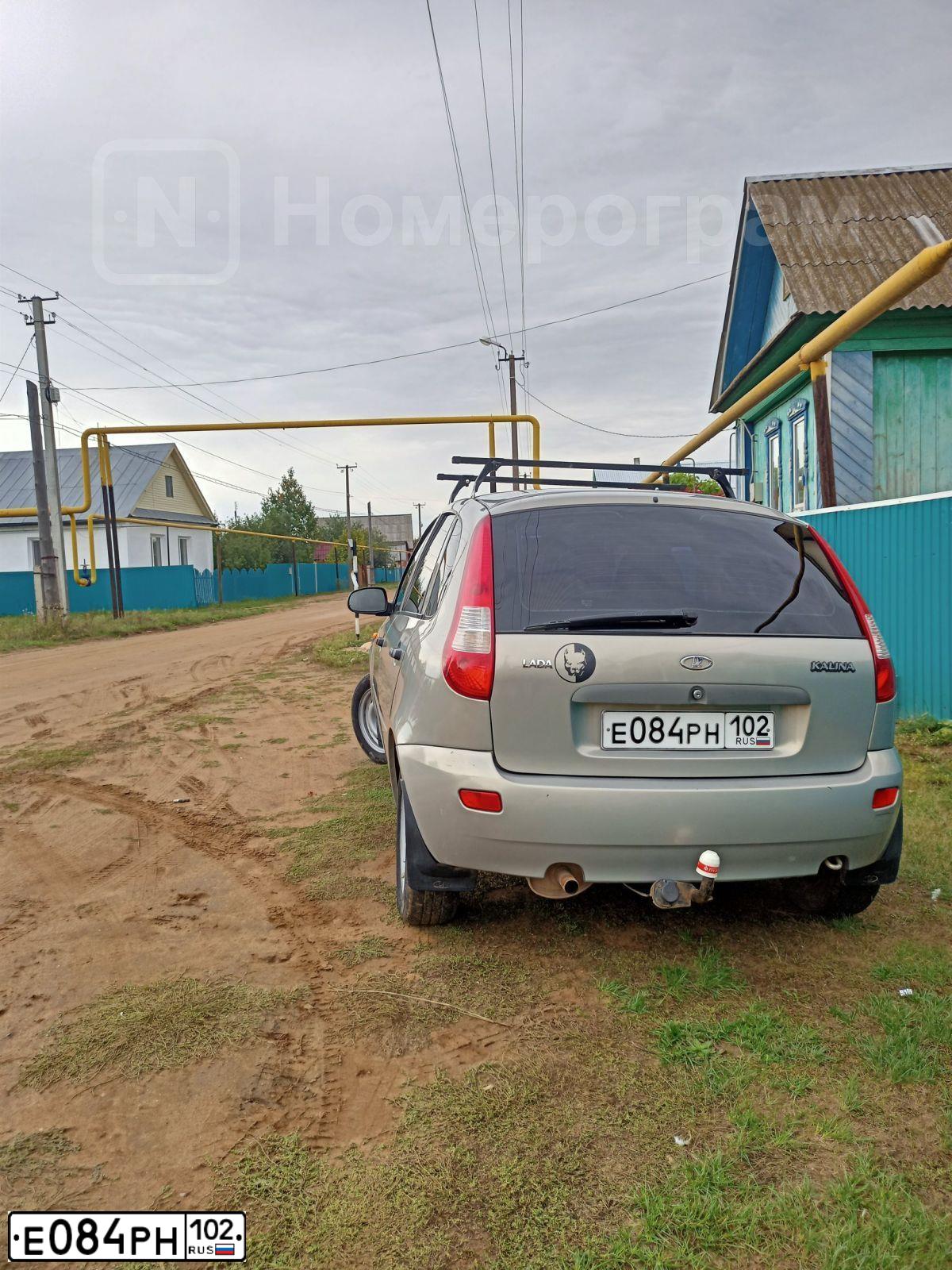 Фото автомобиля LADA 1119 KALINA, 2008 — госномер Е084РН102. Цвет: БЕЖЕВО-СЕРЫЙ