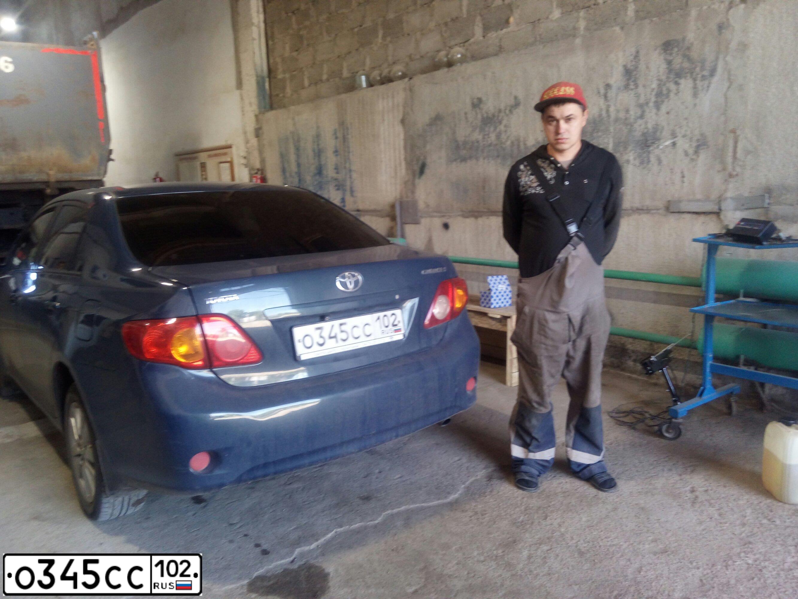 Фото автомобиля TOYOTA COROLLA, 2007 — госномер К069МК702. Цвет: Темно-синий