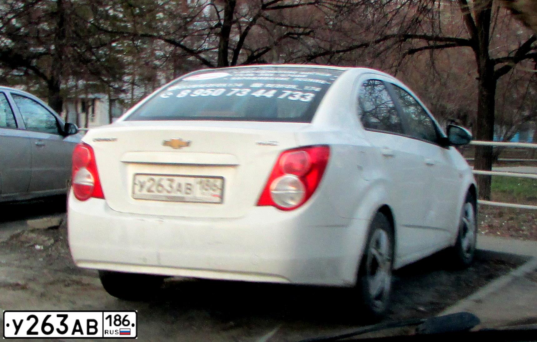 Фото автомобиля CHEVROLET AVEO, 2012 — госномер У263АВ186. Цвет: БЕЛЫЙ