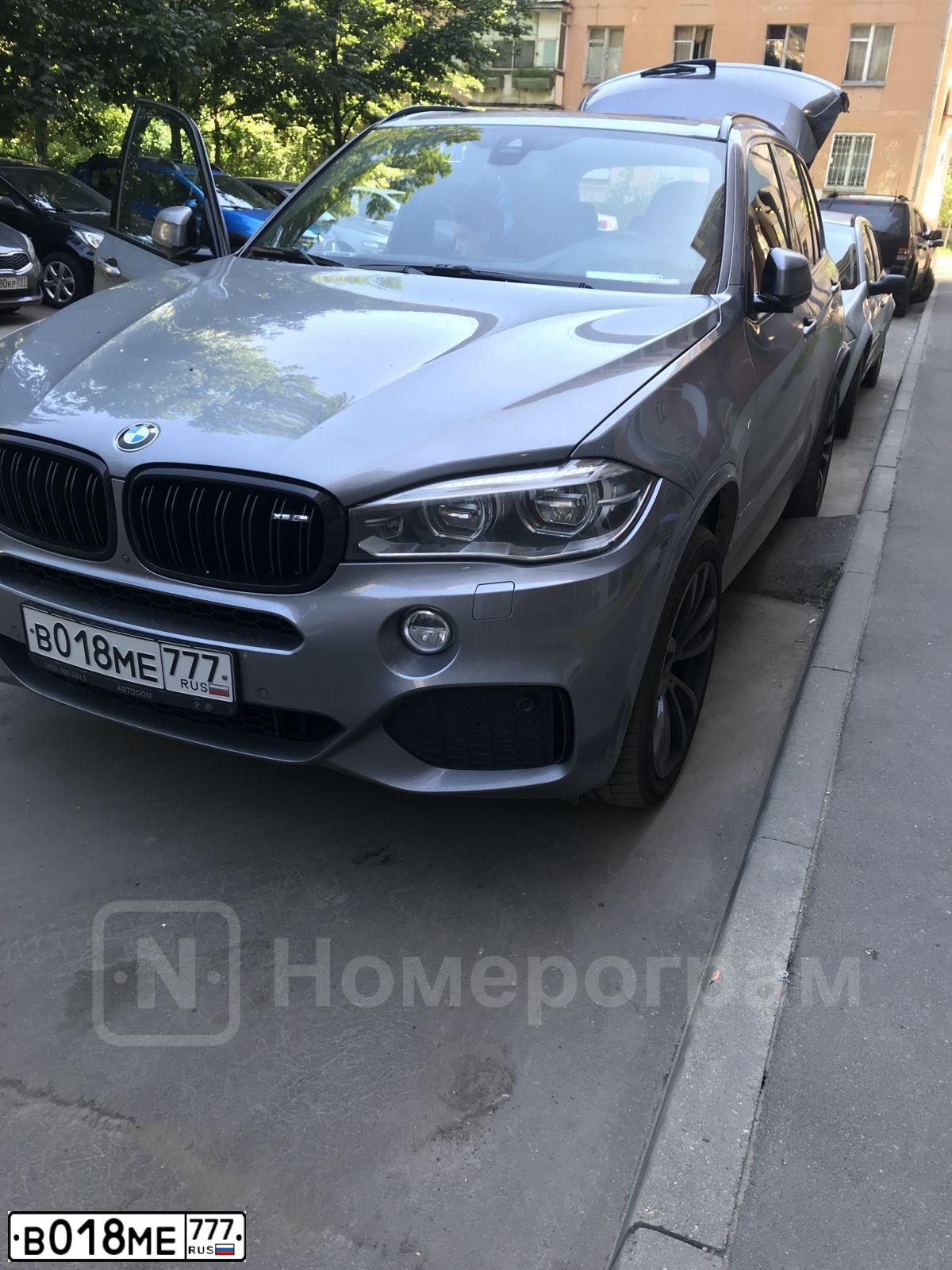 Фото автомобиля BMW X5, 2014 — госномер В018МЕ777. Цвет: СЕРЫЙ