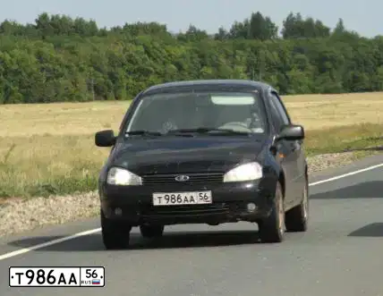 Фото автомобиля LADA 1119 KALINA, 2011 — госномер Т986АА56. Цвет: Сине-Черный