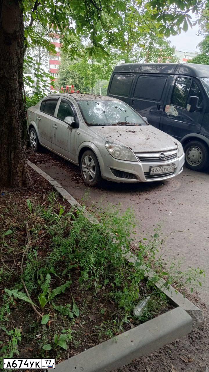 Фото автомобиля OPEL ASTRA, 2012 — госномер А674УК77. Цвет: СЕРЫЙ СВЕТЛЫЙ