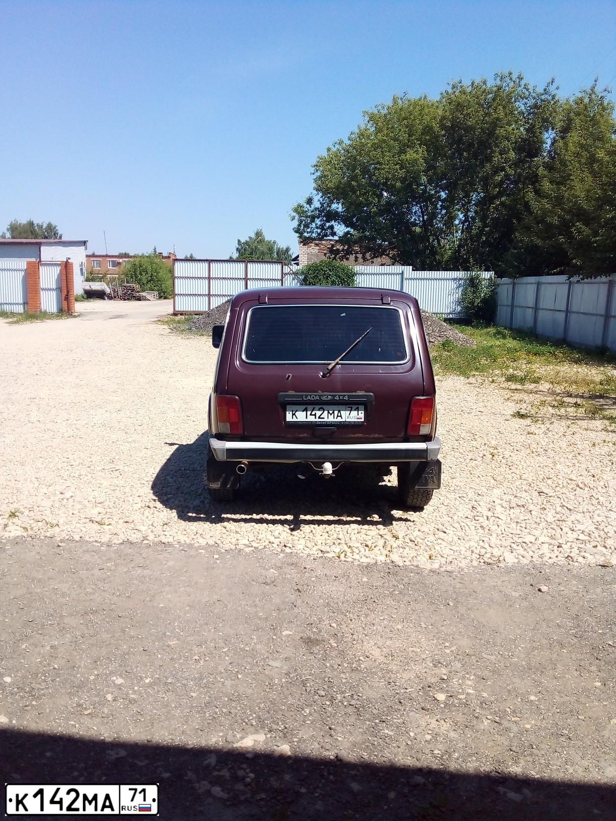 Фото автомобиля LADA 2121 NIVA, 2007 — госномер К142МА71. Цвет: ТЕМНО-ВИШНЕВЫЙ
