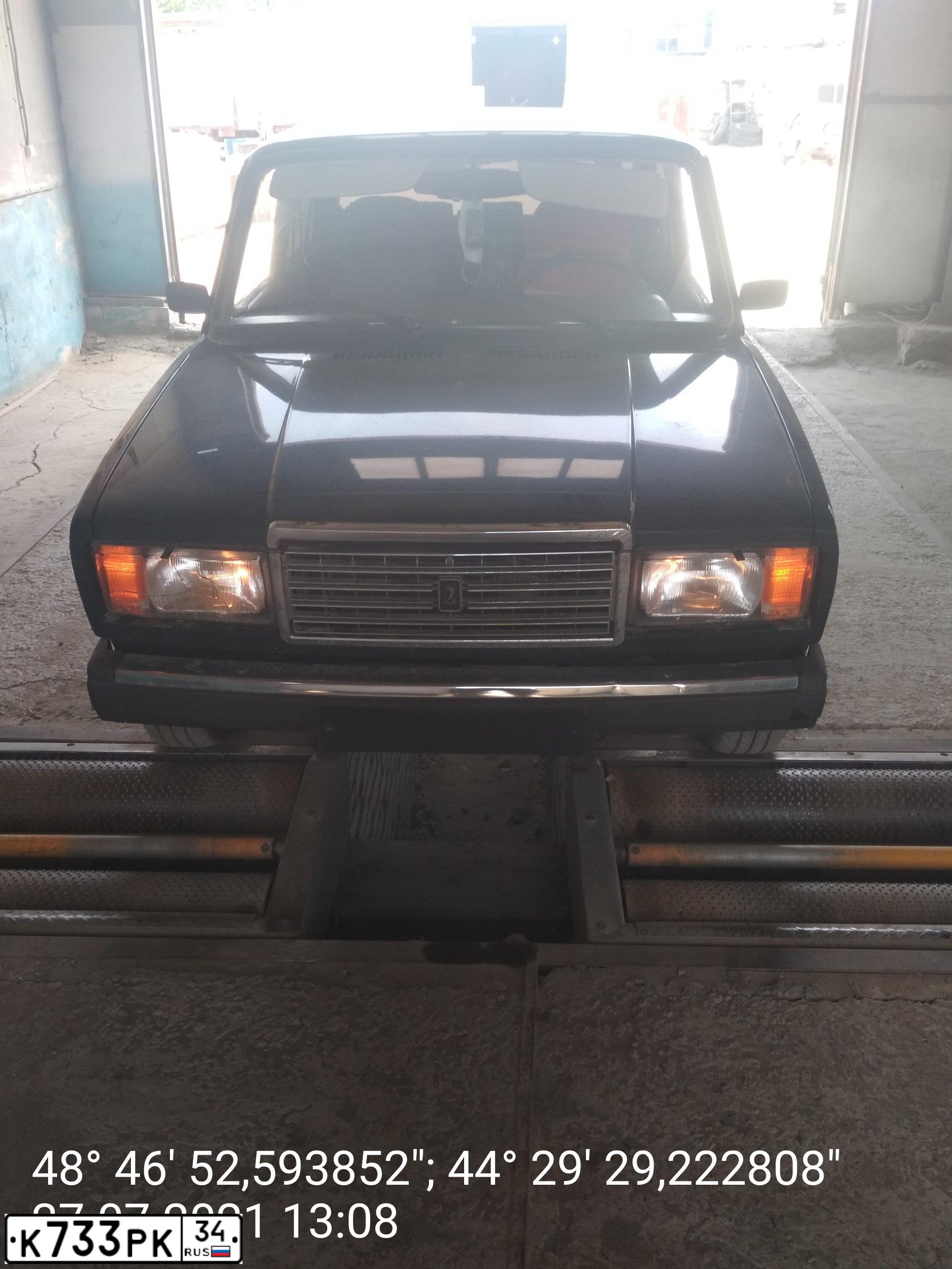 Фото автомобиля LADA 2107 LADA, 2007 — госномер Е772УТ134. Цвет: ТЕМНО ЗЕЛЕНЫЙ