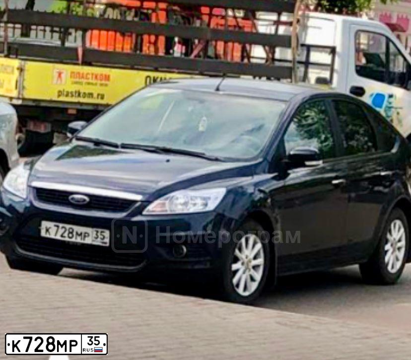 Фото автомобиля FORD FOCUS, 2010 — госномер К728МР35. Цвет: ТЕМНО-СЕРЫЙ