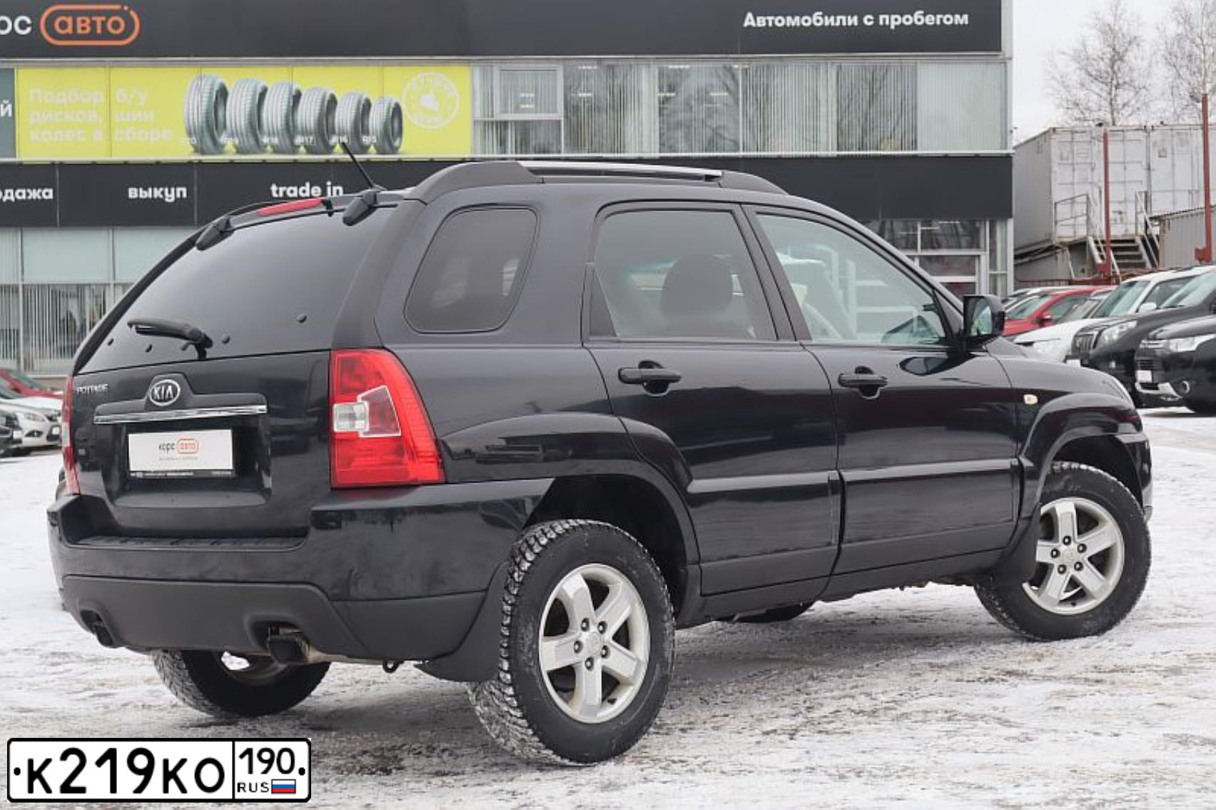Фото автомобиля KIA SPORTAGE, 2010 — госномер К219КО190. Цвет: ЧЕРНЫЙ