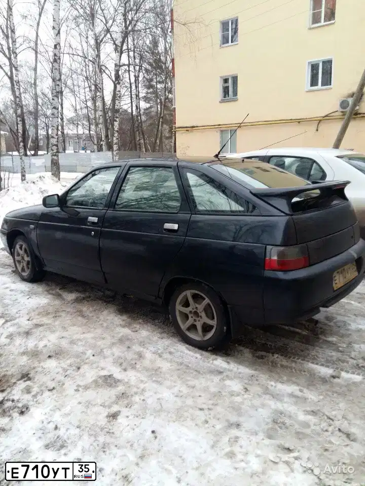 Фото автомобиля LADA 2112 LADA, 2005 — госномер Е710УТ35. Цвет: ГРАФИТОВЫЙ МЕТАЛЛИК