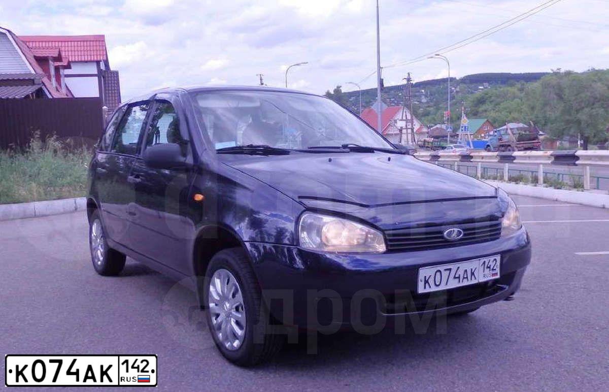Фото автомобиля LADA KALINA, 2008 — госномер Р693СТ70. Цвет: Темный Сине-Фиолетовый