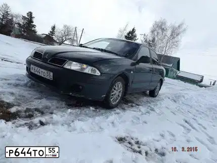 Фото автомобиля MITSUBISHI CARISMA, 2000 — госномер Р644ТО55. Цвет: Темно-зеленый