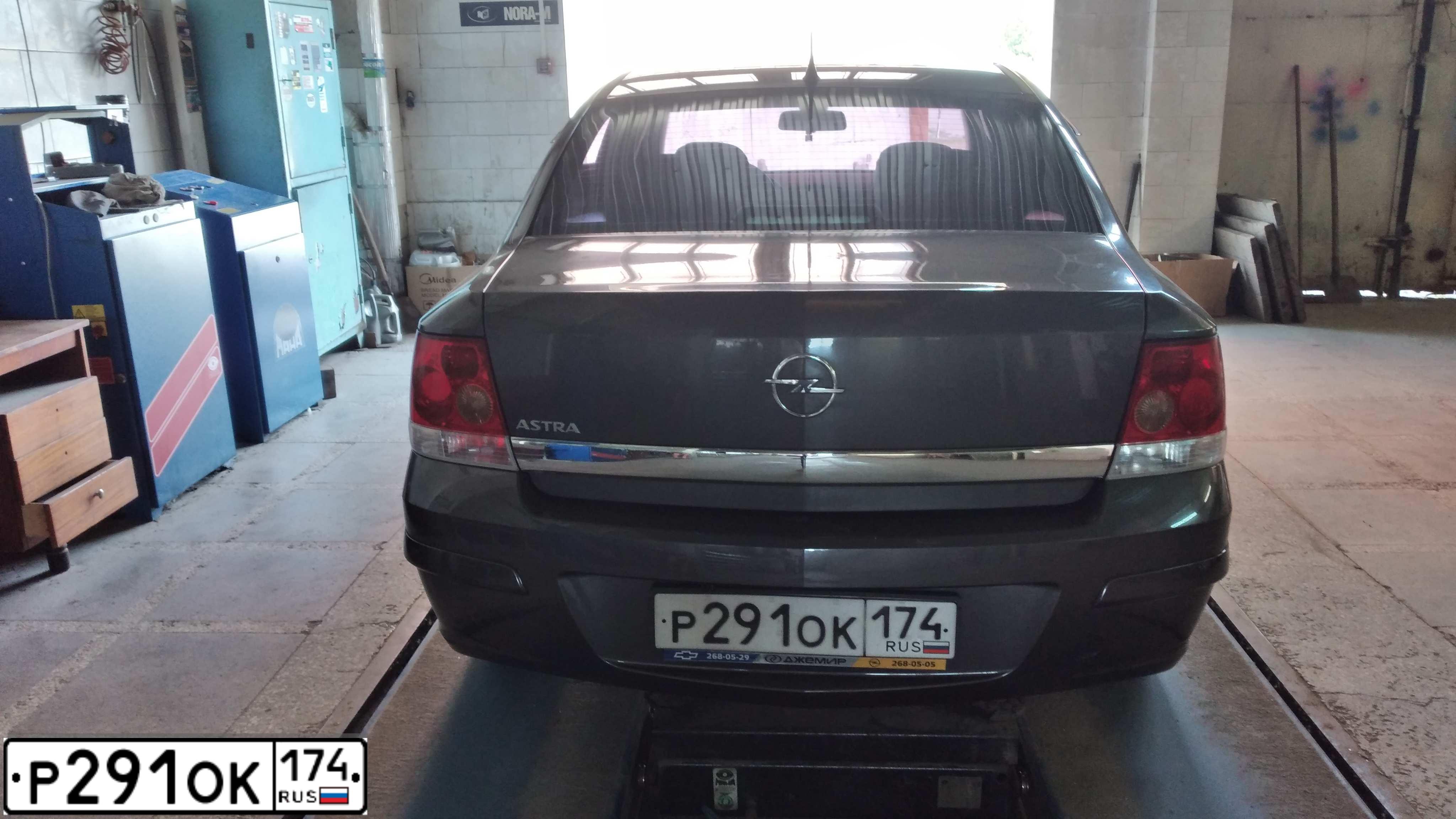 Фото автомобиля OPEL ASTRA, 2011 — госномер Р291ОК174. Цвет: ТЕМНО-СЕРЫЙ