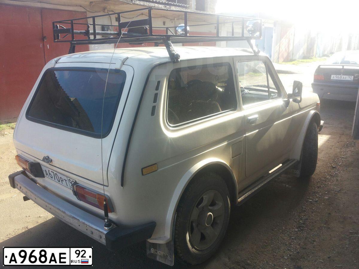 Фото автомобиля BMW 316I, 1991 — госномер М256ВВ82. Цвет: синий