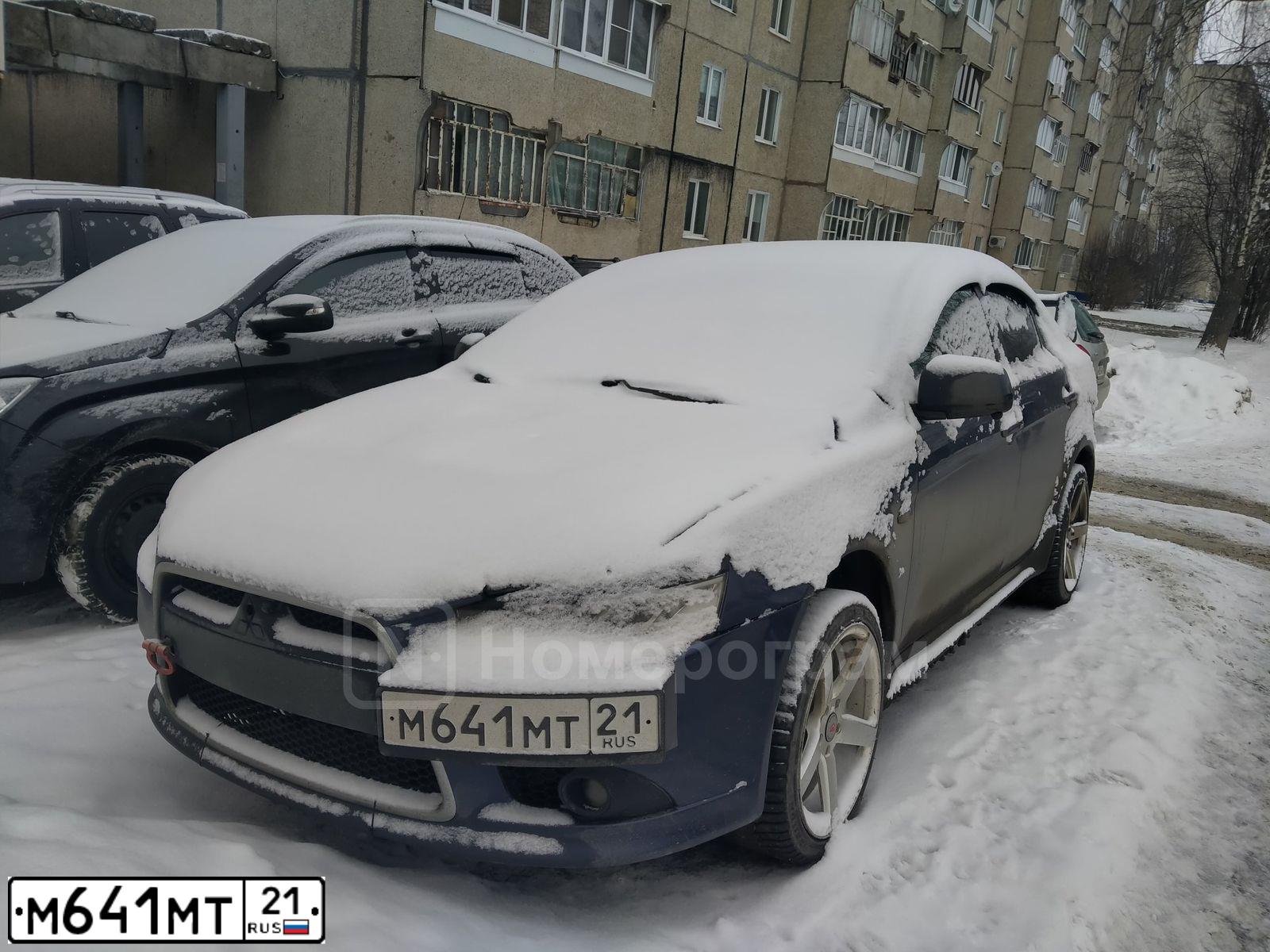 Фото автомобиля MITSUBISHI LANCER, 2011 — госномер М641МТ21. Цвет: синий