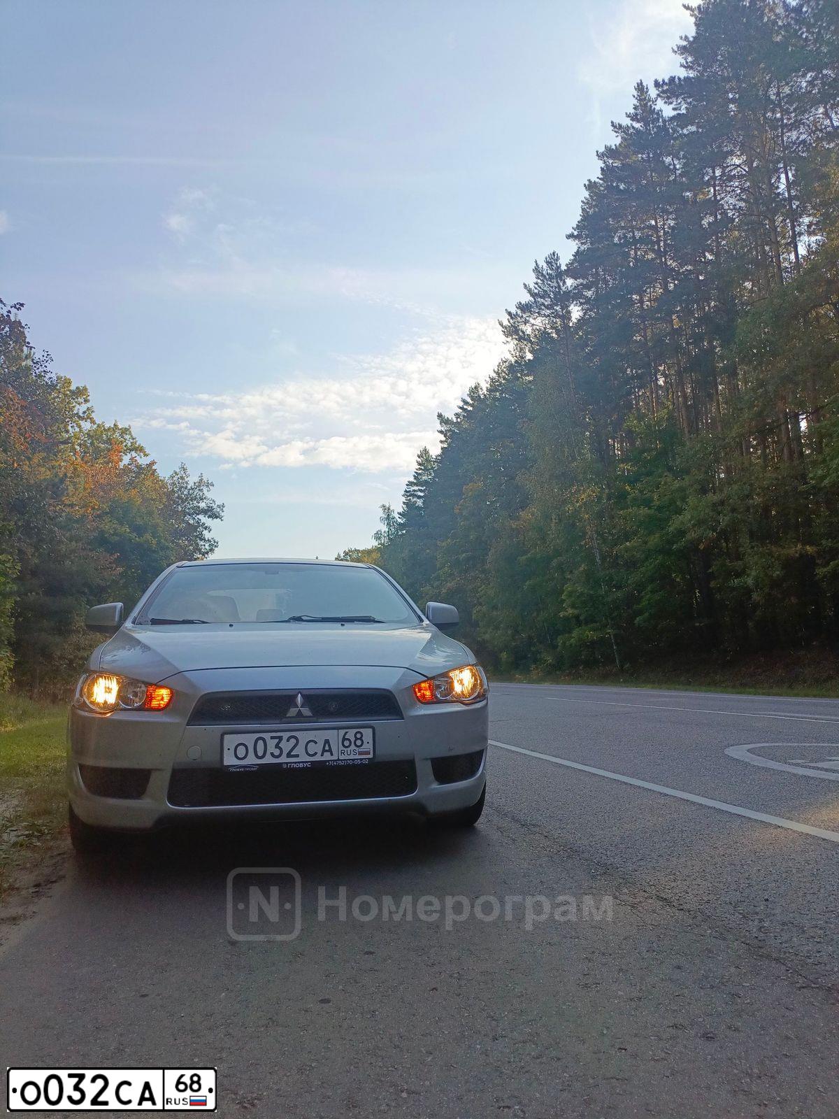 Фото автомобиля MITSUBISHI LANCER, 2008 — госномер О032СА68. Цвет: Серебристый