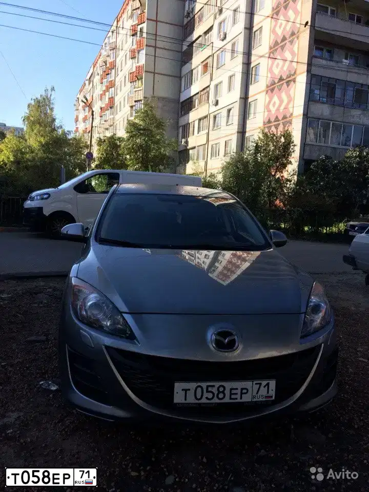 Фото автомобиля MAZDA 3, 2010 — госномер М711МХ71. Цвет: серебристый