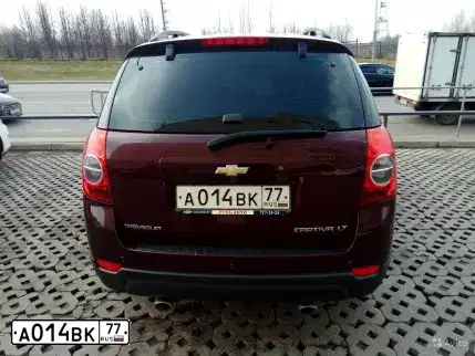 Фото автомобиля CHEVROLET CAPTIVA, 2013 — госномер Р231РМ33. Цвет: Красный
