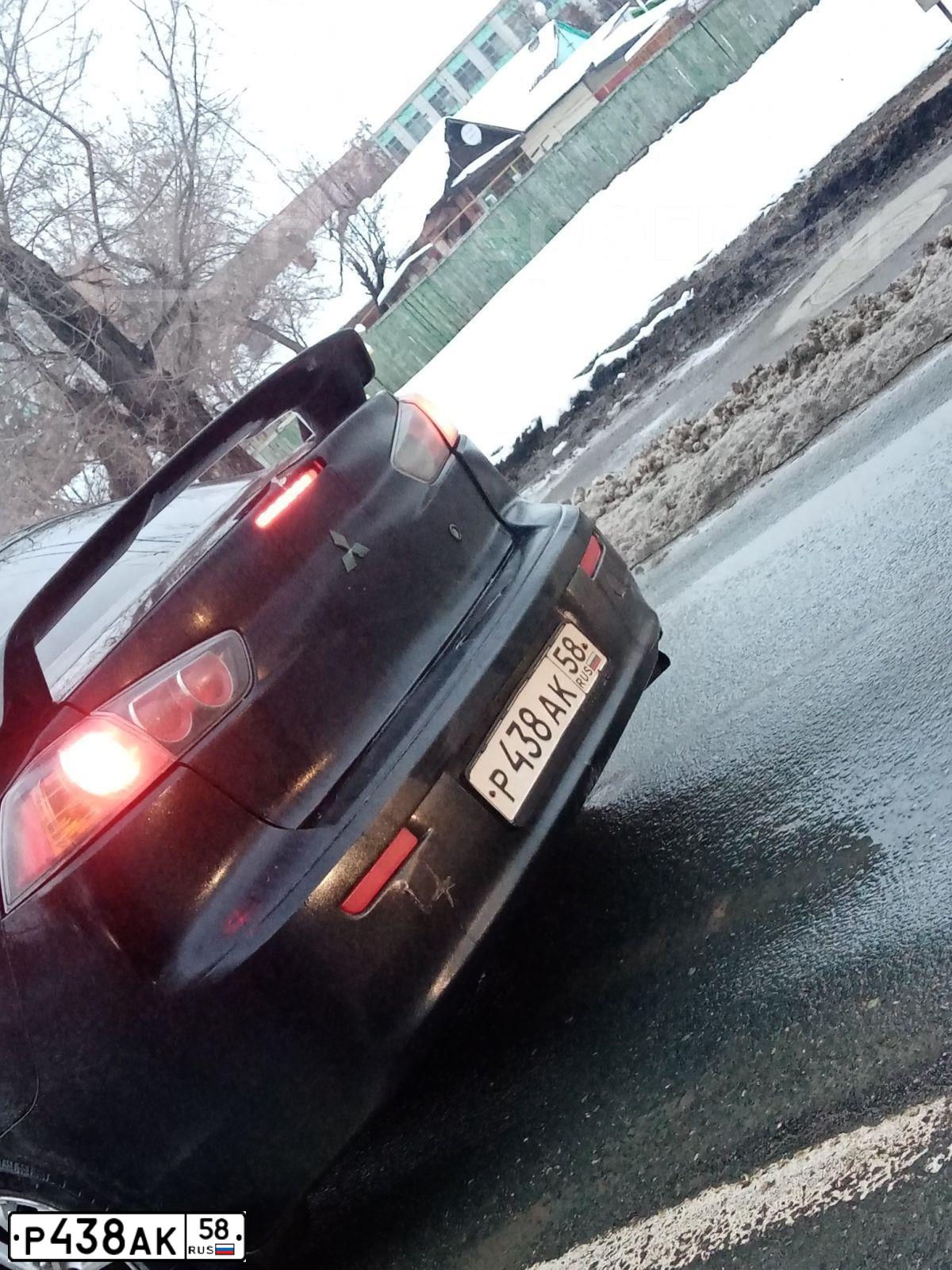 Фото автомобиля MITSUBISHI LANCER, 2011 — госномер Р438АК58. Цвет: ЧЕРНЫЙ