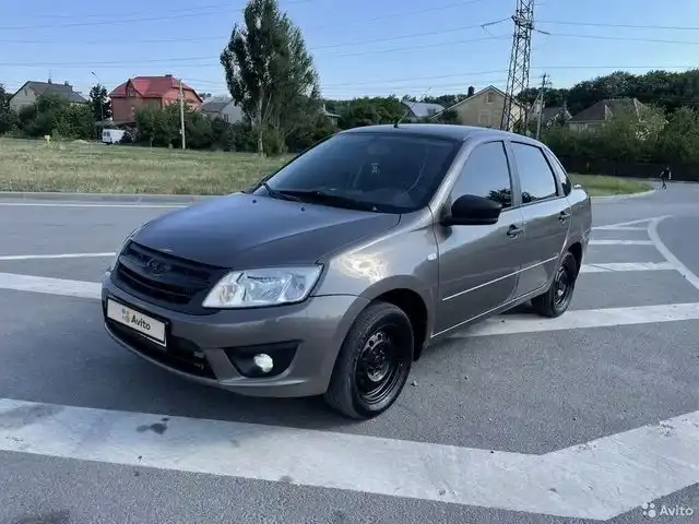 Фото автомобиля LADA 2190 GRANTA, 2017 — госномер В656ТК09. Цвет: Золотисто-коричневый
