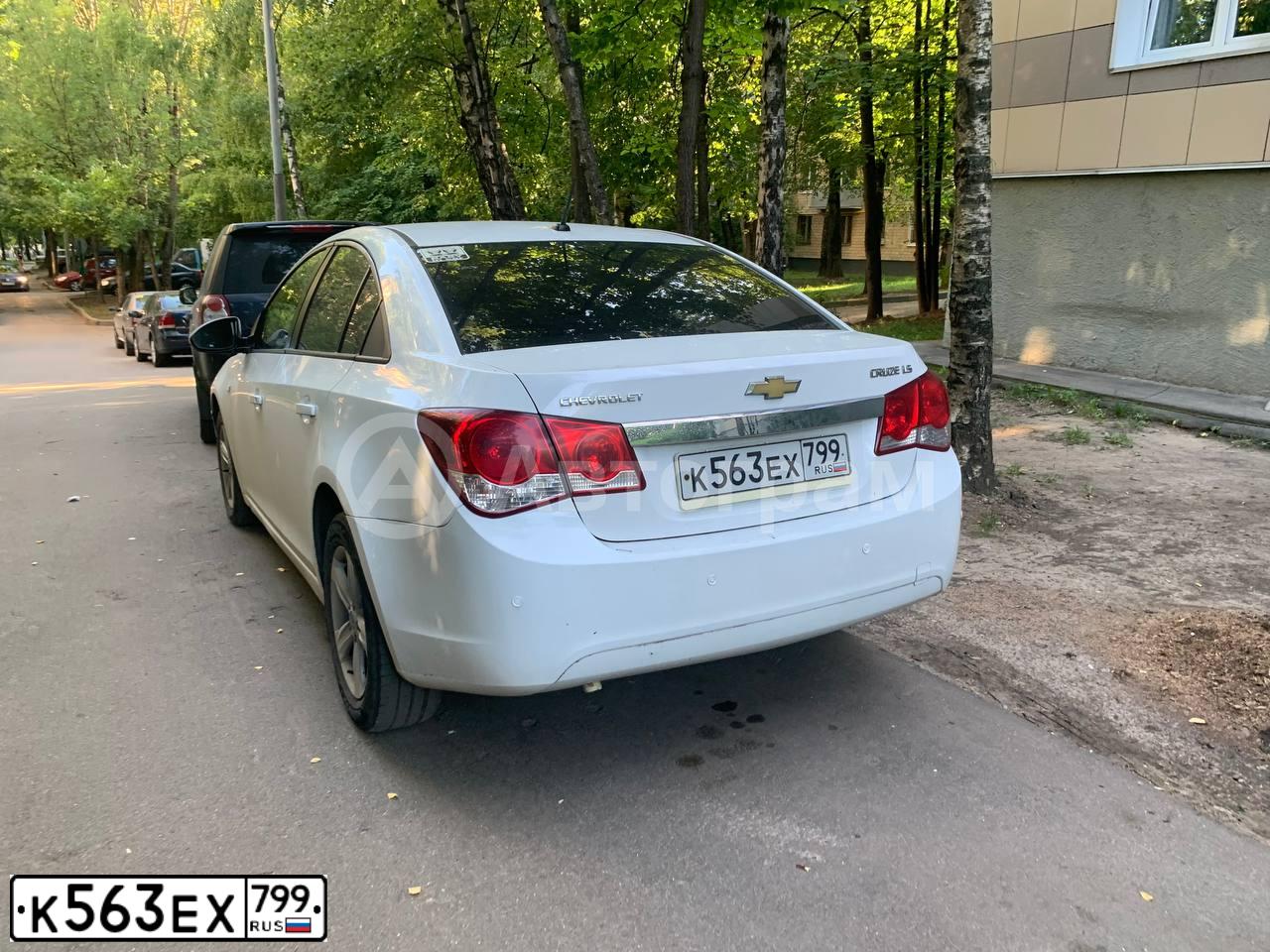 Фото автомобиля CHEVROLET CRUZE, 2012 — госномер К563ЕХ799. Цвет: Белый