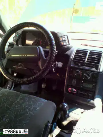 Фото автомобиля LADA 2112, 2004 — госномер К160ЕР53. Цвет: Темно-зеленый