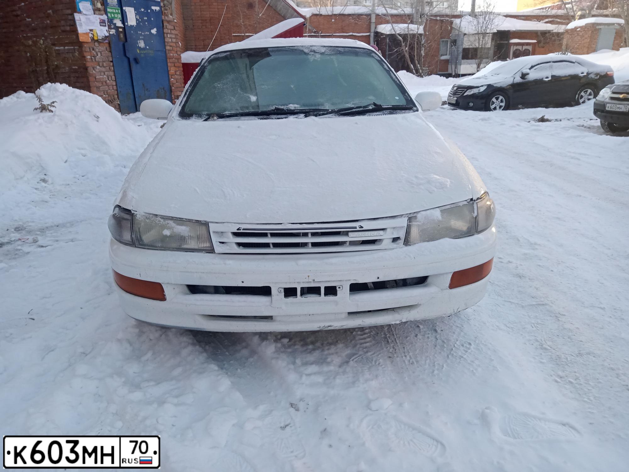 Фото автомобиля NISSAN NOTE, 2008 — госномер Е063ЕВ70. Цвет: Серебристый