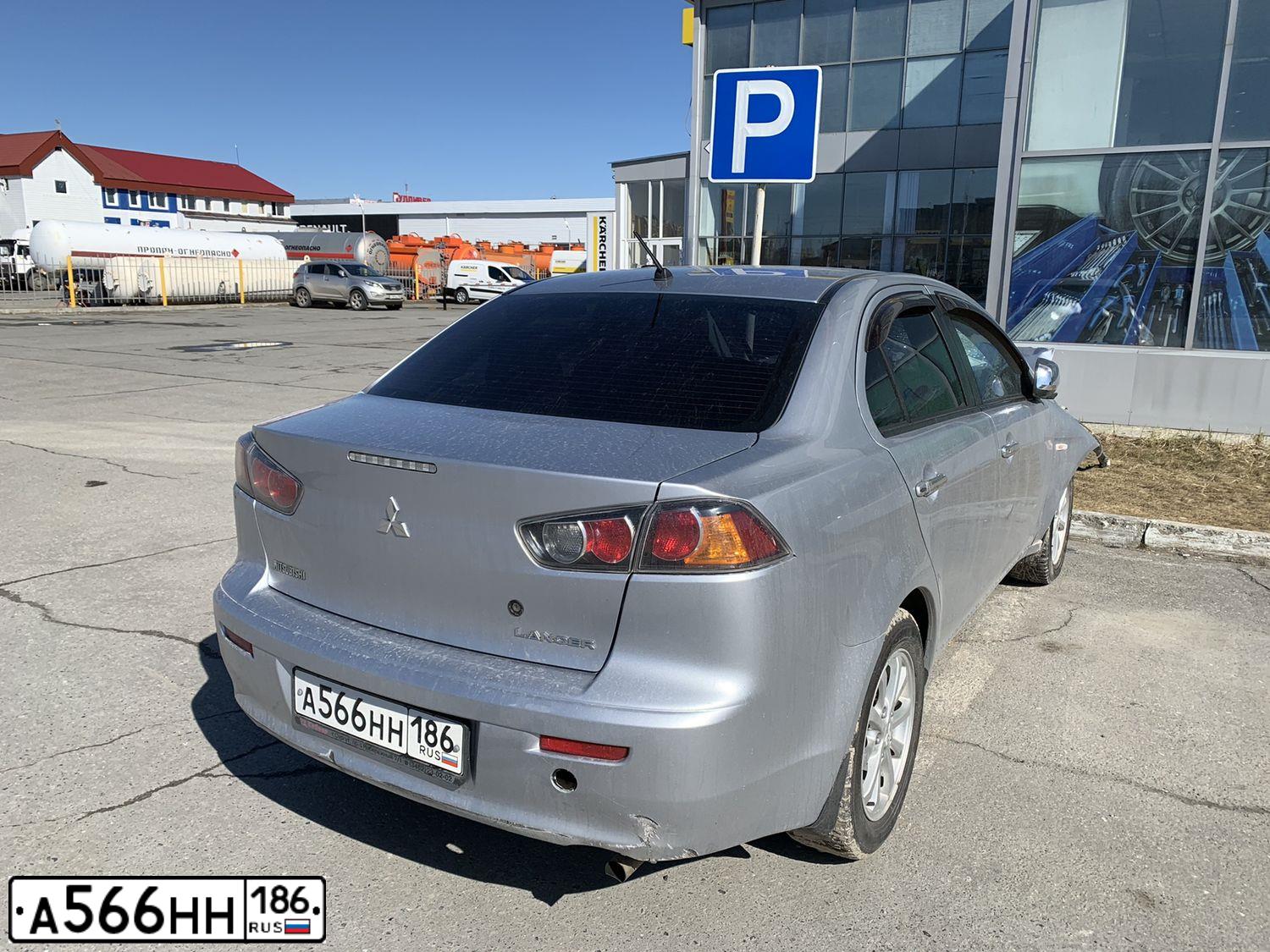Фото автомобиля MITSUBISHI LANCER, 2010 — госномер А574ВТ774. Цвет: Серебристый