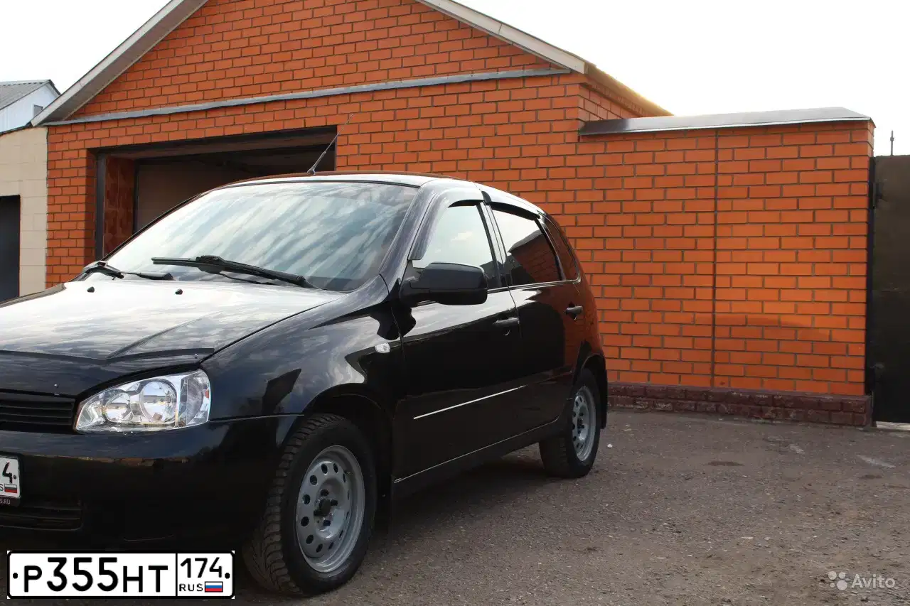 Фото автомобиля LADA 1119 KALINA, 2011 — госномер В604УК702. Цвет: СИНЕ-ЧЕРНЫЙ